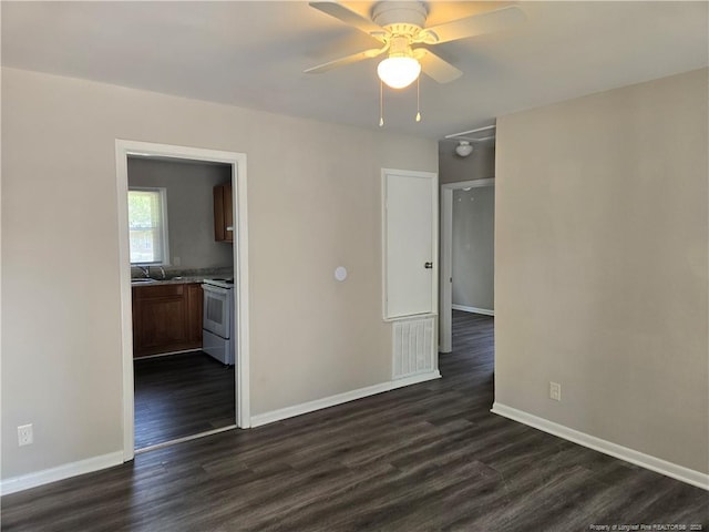 703 Lake Ave, Spring Lake, NC 28390 - unfurnished room featuring dark wood finished floors and ceiling fan
