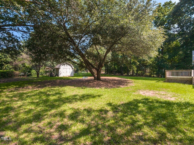 6020 Wildorlyn Cir, Raleigh, NC 27603 - view of green lawn with a storage unit and a wooden deck
