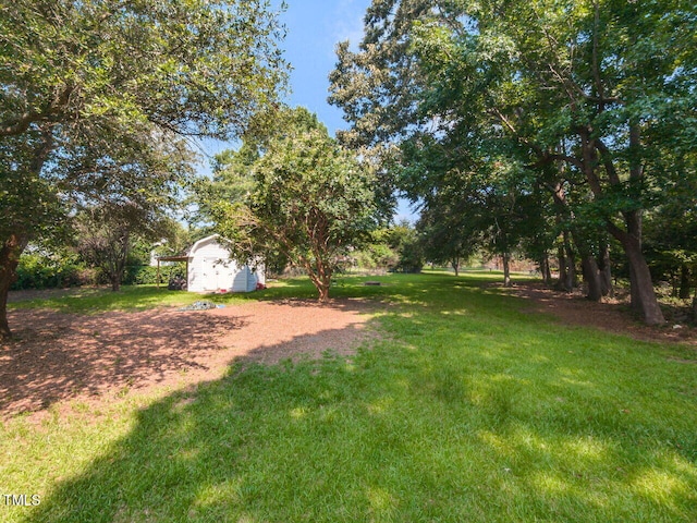 6020 Wildorlyn Cir, Raleigh, NC 27603 - view of grassy yard featuring a storage shed