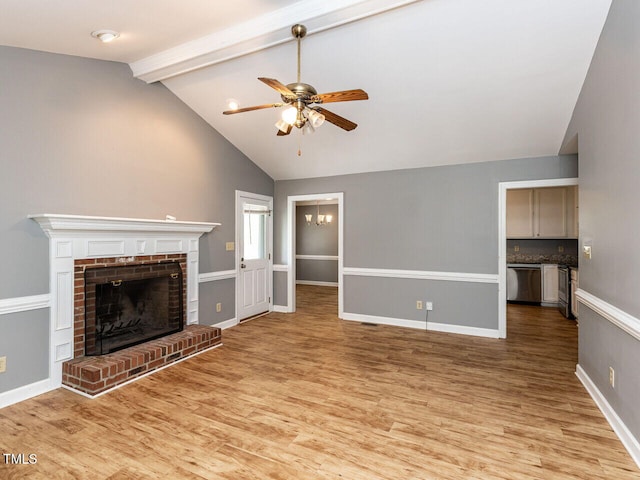 6020 Wildorlyn Cir, Raleigh, NC 27603 - unfurnished living room with light wood-style floors, ceiling fan, a fireplace, beam ceiling, and high vaulted ceiling