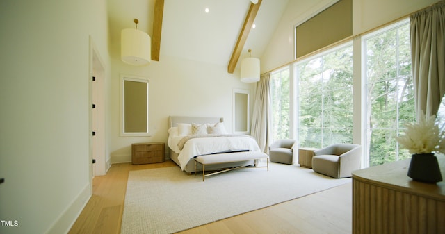 1620 Hunting Ridge Rd, Raleigh, NC 27615 - bedroom with high vaulted ceiling, beamed ceiling, and wood finished floors