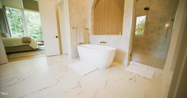 1620 Hunting Ridge Rd, Raleigh, NC 27615 - bathroom featuring a freestanding tub, a stall shower, healthy amount of natural light, and ensuite bathroom