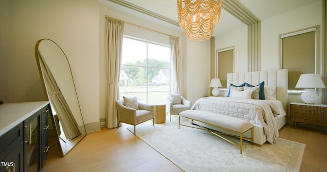 1620 Hunting Ridge Rd, Raleigh, NC 27615 - bedroom featuring a chandelier and light wood-style flooring