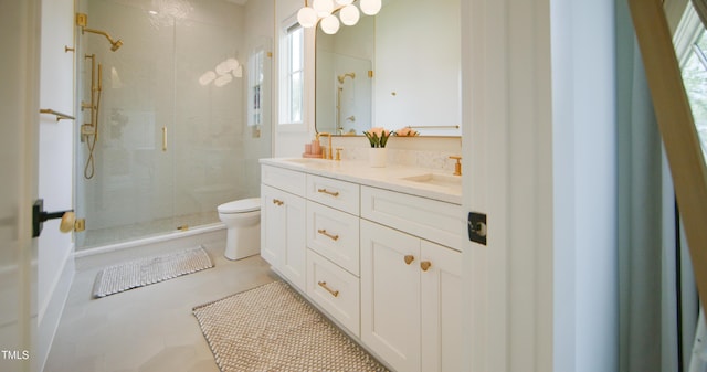 1620 Hunting Ridge Rd, Raleigh, NC 27615 - bathroom featuring a shower stall, double vanity, and plenty of natural light