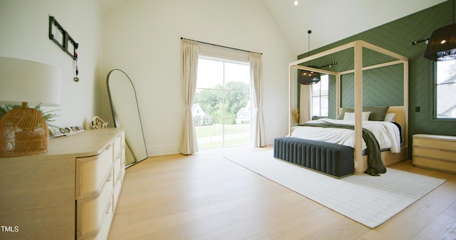 1620 Hunting Ridge Rd, Raleigh, NC 27615 - bedroom with access to exterior, high vaulted ceiling, and light wood finished floors
