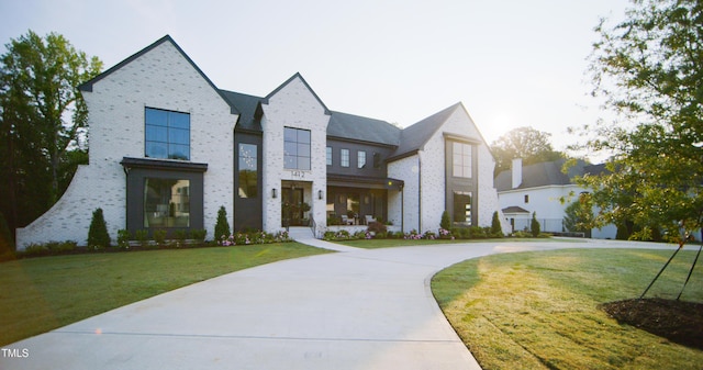 1620 Hunting Ridge Rd, Raleigh, NC 27615 - view of front facade with a front yard and brick siding