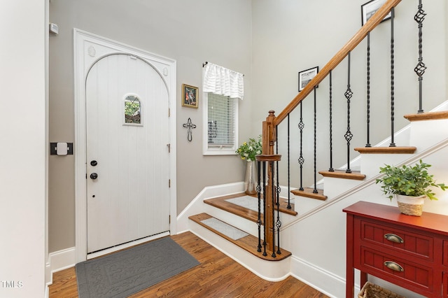 254 Charter Ct SE, Concord, NC 28025 - entrance foyer featuring stairway and wood finished floors