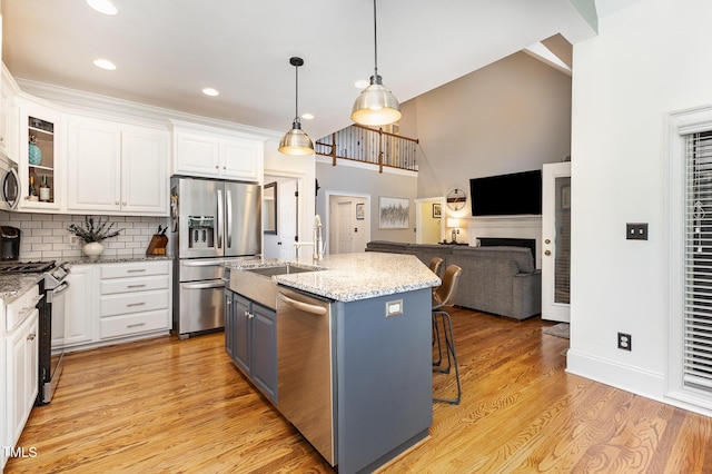 254 Charter Ct SE, Concord, NC 28025 - kitchen featuring appliances with stainless steel finishes, white cabinetry, light stone countertops, decorative backsplash, and recessed lighting