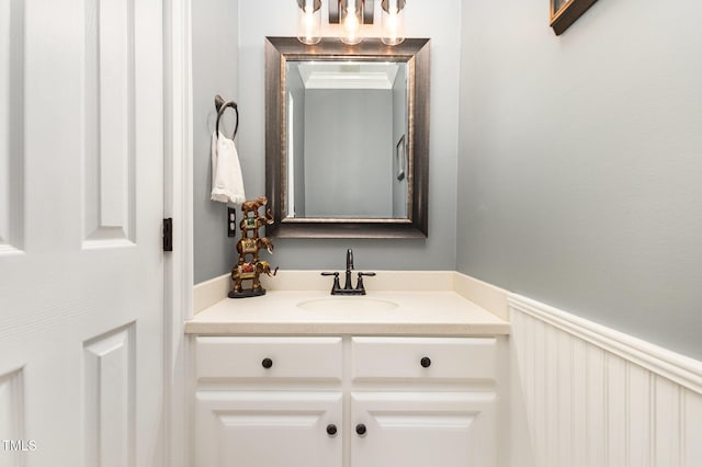 254 Charter Ct SE, Concord, NC 28025 - bathroom featuring vanity, a chandelier, and a wainscoted wall