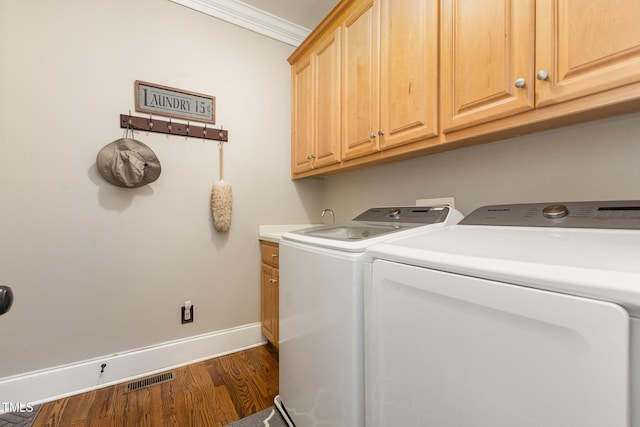 254 Charter Ct SE, Concord, NC 28025 - laundry area featuring independent washer and dryer, cabinet space, wood finished floors, and crown molding