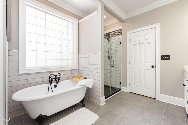 254 Charter Ct SE, Concord, NC 28025 - full bathroom featuring a freestanding tub, a stall shower, crown molding, vanity, and tile walls