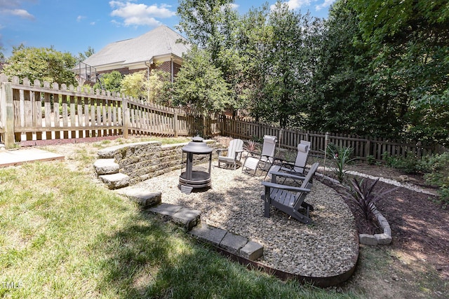 254 Charter Ct SE, Concord, NC 28025 - fenced backyard featuring a fire pit