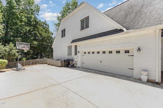 254 Charter Ct SE, Concord, NC 28025 - view of side of property with brick siding, roof with shingles, and driveway