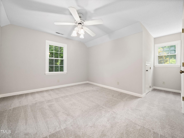 1708 Lake Park Dr, Raleigh, NC 27612 - empty room featuring lofted ceiling, carpet flooring, and ceiling fan
