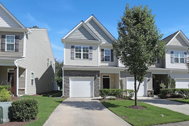 3636 Water Mist Ln, Raleigh, NC 27604 - view of front of home featuring driveway, an attached garage, a front yard, and stone siding