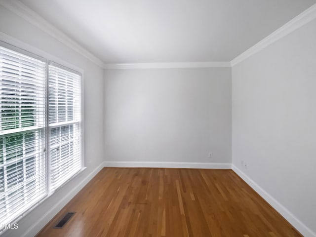 2408 Tiltonshire Ln, Apex, NC 27539 - spare room featuring wood finished floors and crown molding