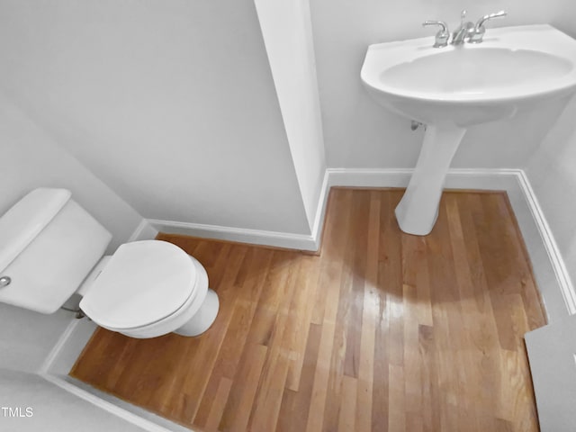 2408 Tiltonshire Ln, Apex, NC 27539 - half bath featuring toilet and wood finished floors