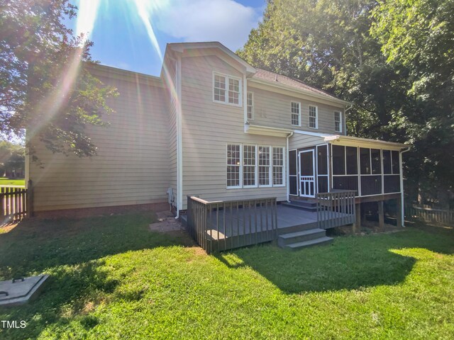 2408 Tiltonshire Ln, Apex, NC 27539 - rear view of property featuring a sunroom and a wooden deck