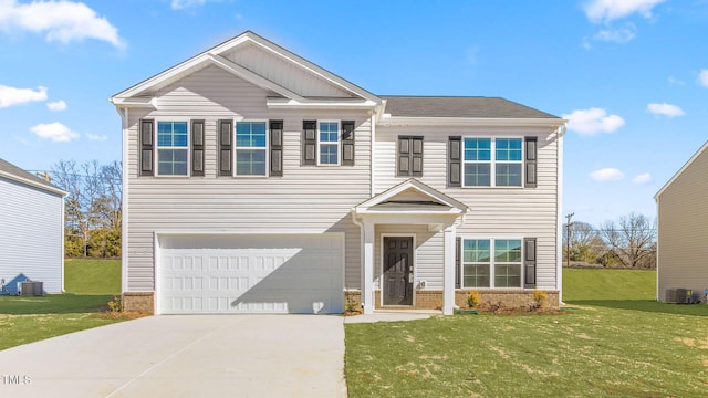 120 Leven Dr, Gibsonville, NC 27249 - view of front facade featuring a garage, concrete driveway, and a front lawn