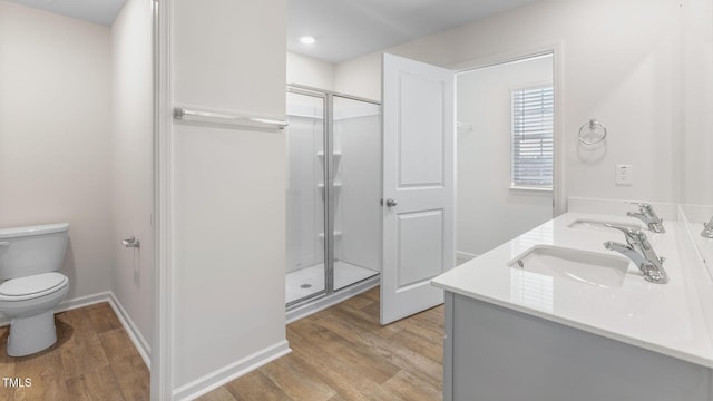 120 Leven Dr, Gibsonville, NC 27249 - bathroom with wood finished floors, a stall shower, and double vanity