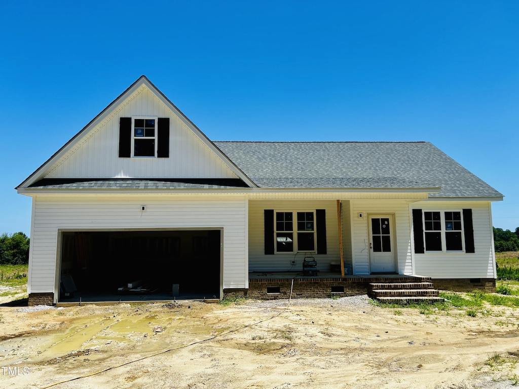 6750 Fire Tower Rd, Bailey, NC 27807 - view of front of home with covered porch, a shingled roof, crawl space, and an attached garage