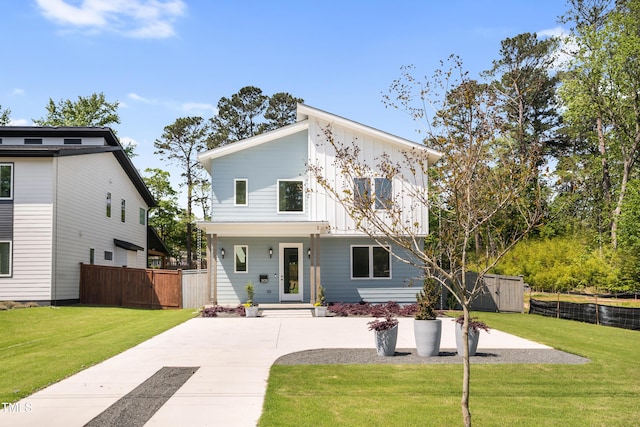 505 Colleton Rd, Raleigh, NC 27610 - view of front of property featuring board and batten siding, a storage shed, and concrete driveway