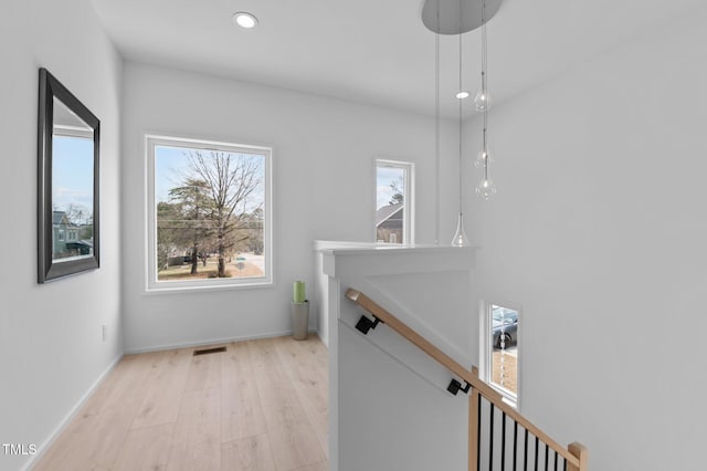 505 Colleton Rd, Raleigh, NC 27610 - corridor with an upstairs landing, healthy amount of natural light, light wood-style flooring, and recessed lighting