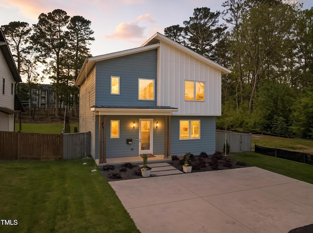 505 Colleton Rd, Raleigh, NC 27610 - view of front of house with board and batten siding, a porch, and a patio area