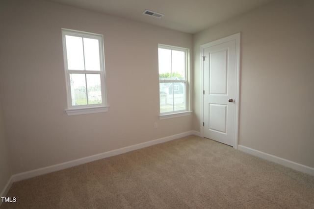912 Montague Ave, Durham, NC 27703 - empty room featuring light carpet and baseboards