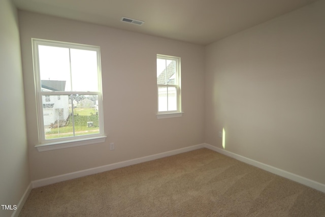 912 Montague Ave, Durham, NC 27703 - carpeted spare room featuring baseboards