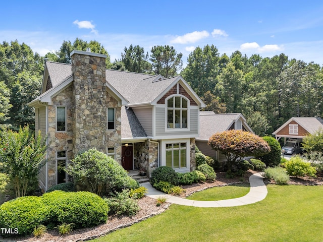 267 Bald Eagle Dr, Pittsboro, NC 27312 - view of front of home with stone siding, a shingled roof, and a front lawn