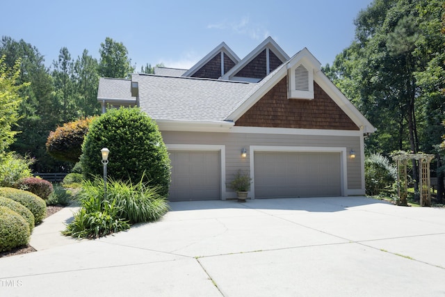 267 Bald Eagle Dr, Pittsboro, NC 27312 - view of front of property with driveway, an attached garage, and roof with shingles