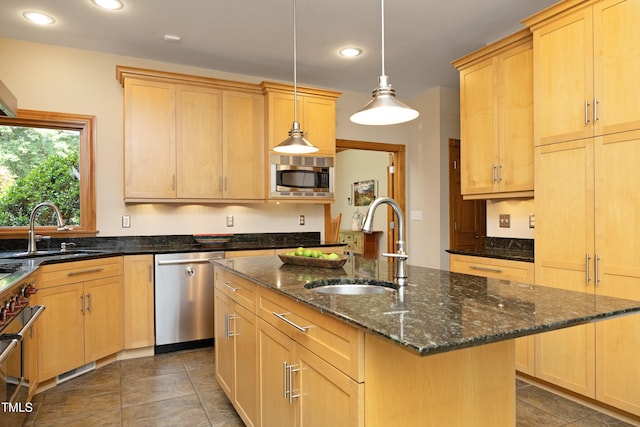 267 Bald Eagle Dr, Pittsboro, NC 27312 - kitchen featuring appliances with stainless steel finishes, light brown cabinetry, recessed lighting, tile patterned floors, and an island with sink