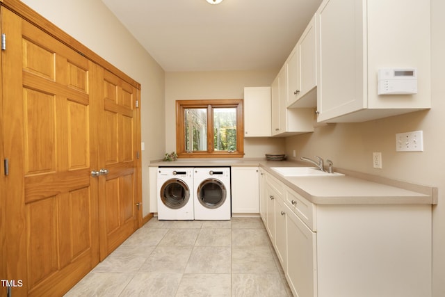267 Bald Eagle Dr, Pittsboro, NC 27312 - laundry area featuring washing machine and clothes dryer, cabinet space, and light tile patterned flooring