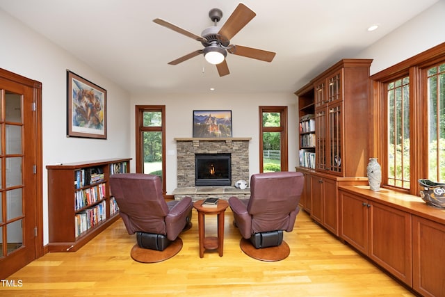 267 Bald Eagle Dr, Pittsboro, NC 27312 - sitting room with light wood-style flooring, a fireplace, a ceiling fan, and recessed lighting