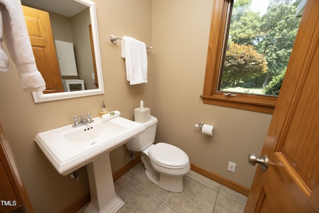 267 Bald Eagle Dr, Pittsboro, NC 27312 - half bathroom featuring toilet and tile patterned flooring