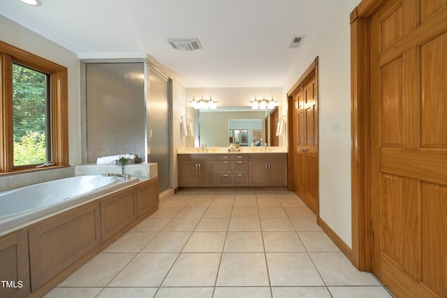 267 Bald Eagle Dr, Pittsboro, NC 27312 - bathroom featuring double vanity, a garden tub, tile patterned flooring, and an enclosed shower