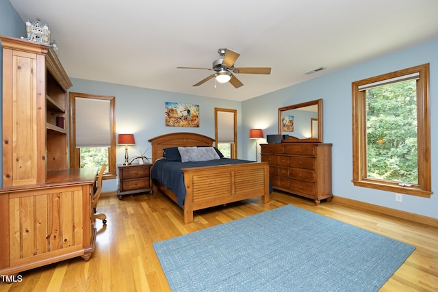 267 Bald Eagle Dr, Pittsboro, NC 27312 - bedroom with light wood-style flooring, a ceiling fan, and an office area