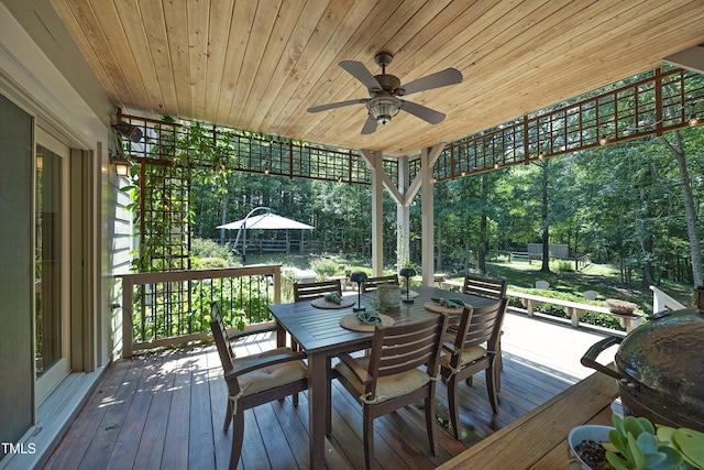 267 Bald Eagle Dr, Pittsboro, NC 27312 - wooden terrace with outdoor dining area and a ceiling fan