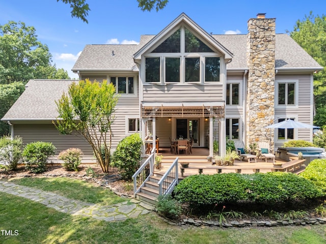 267 Bald Eagle Dr, Pittsboro, NC 27312 - rear view of house featuring a deck, a shingled roof, and a chimney