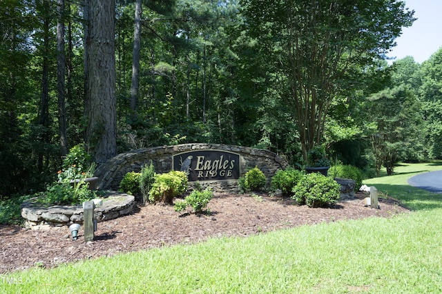 267 Bald Eagle Dr, Pittsboro, NC 27312 - community / neighborhood sign featuring a lawn and a forest view