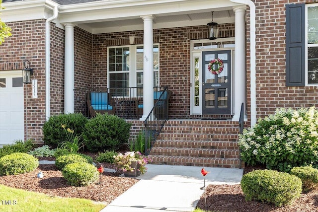 1217 Clandon Square Rd, Hillsborough, NC 27278 - doorway to property featuring brick siding, a porch, and a garage