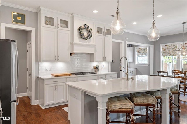 1217 Clandon Square Rd, Hillsborough, NC 27278 - kitchen featuring stainless steel appliances, dark wood-style flooring, light countertops, backsplash, and crown molding