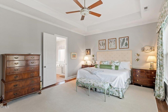 1217 Clandon Square Rd, Hillsborough, NC 27278 - bedroom with wood finished floors, ornamental molding, a tray ceiling, ensuite bathroom, and ceiling fan