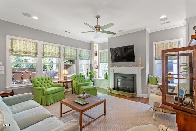 1217 Clandon Square Rd, Hillsborough, NC 27278 - living area featuring ceiling fan, a glass covered fireplace, wood finished floors, recessed lighting, and crown molding