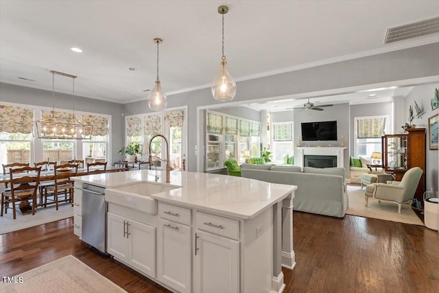 1217 Clandon Square Rd, Hillsborough, NC 27278 - kitchen with dishwasher, a fireplace, a ceiling fan, plenty of natural light, and crown molding