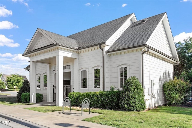 1217 Clandon Square Rd, Hillsborough, NC 27278 - greek revival house featuring a front lawn and a shingled roof