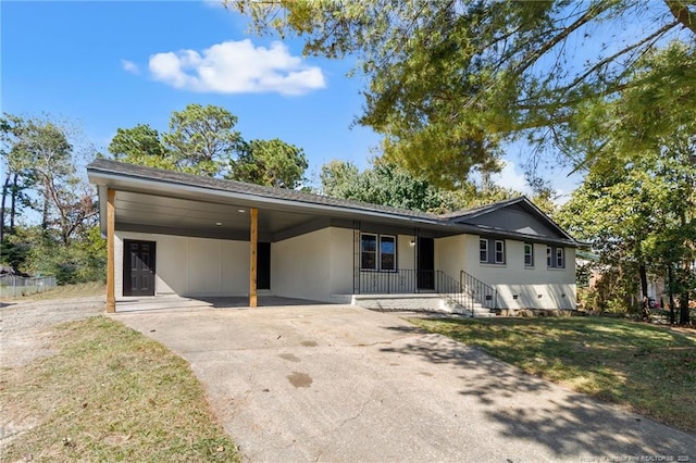 1718 Shiloh Dr, Fayetteville, NC 28304 - view of front facade featuring a carport, concrete driveway, stucco siding, and a front yard