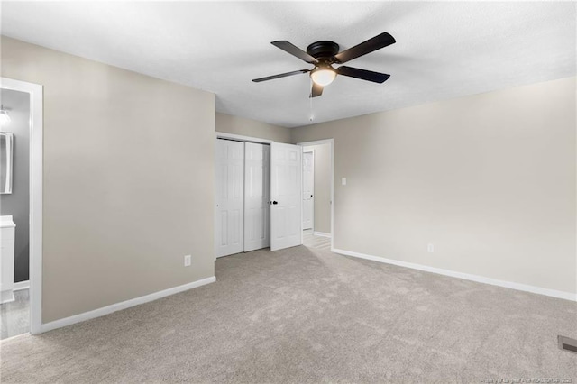 1718 Shiloh Dr, Fayetteville, NC 28304 - unfurnished bedroom with carpet flooring, connected bathroom, a closet, and ceiling fan