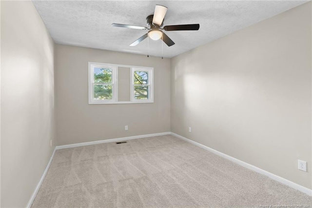 1718 Shiloh Dr, Fayetteville, NC 28304 - carpeted empty room featuring a textured ceiling and a ceiling fan